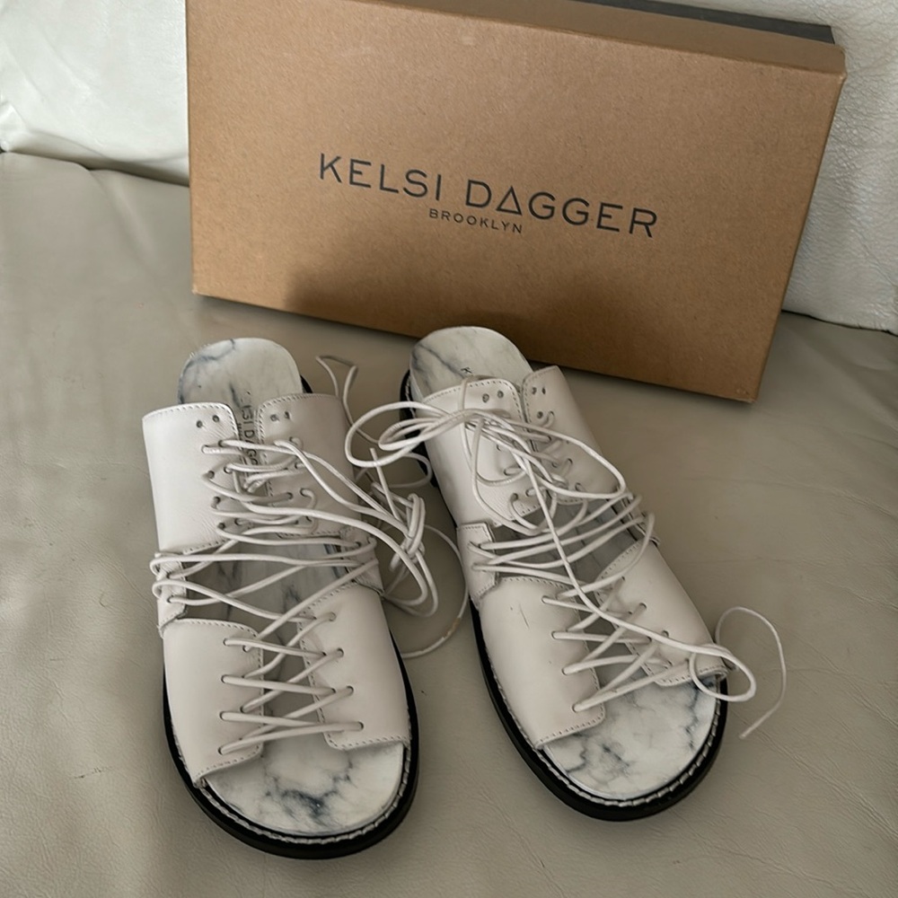 6.5 white, gladiator sandals. Funky and cool style.